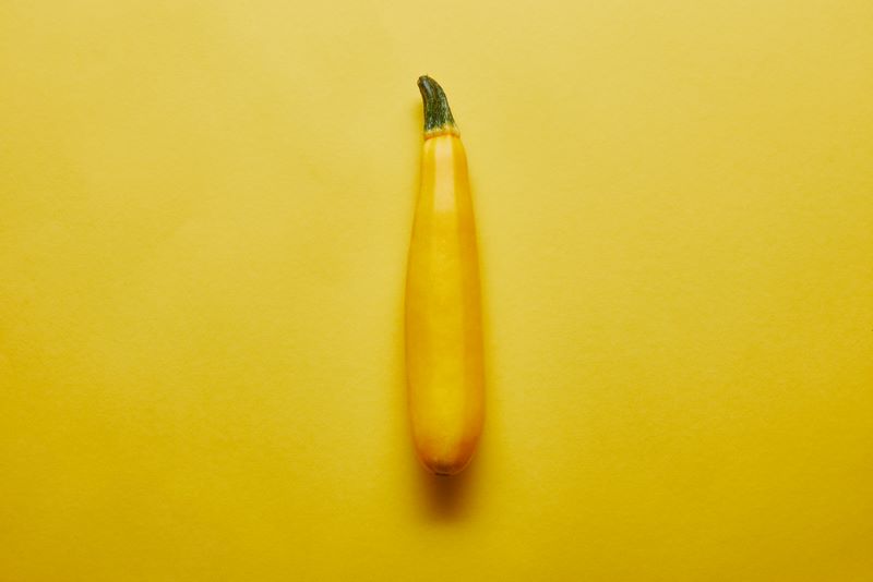 yellow squash in yellow background as owners ask "can hamsters eat yellow squash"
