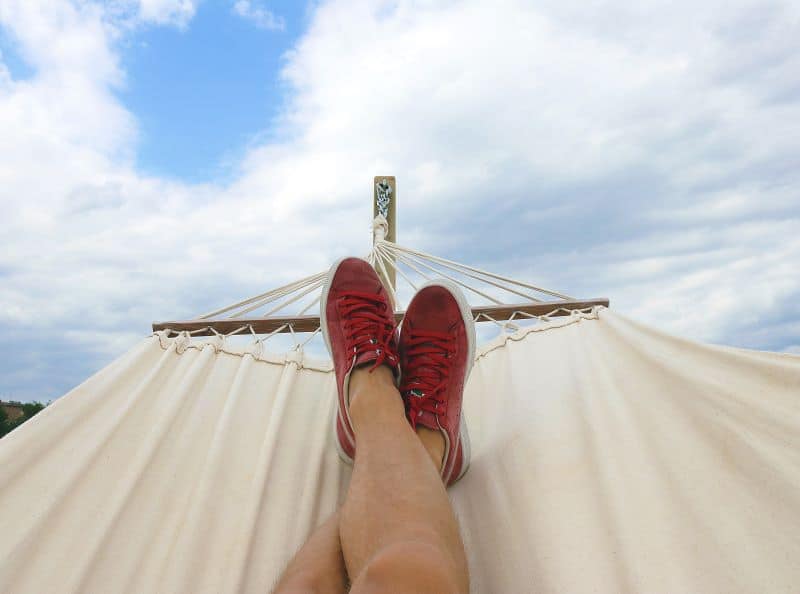man relaxed on vacation as he wonders How to Feed Hamsters When on Holiday