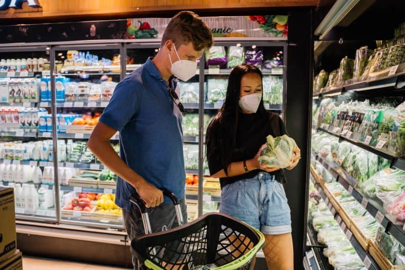 couple in frozen veggies section querying "can hamsters eat frozen collard greens?"