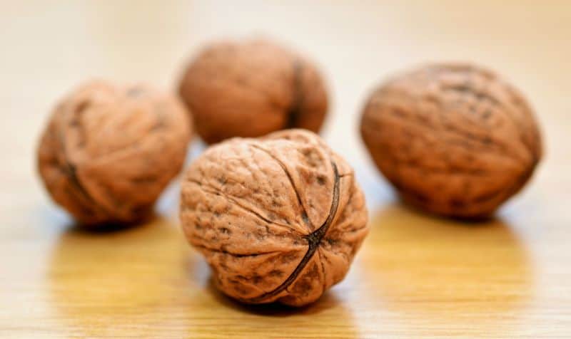 walnuts on a wooden surface